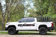 Load image into Gallery viewer, GR_Lifestyle_Toyota_Tundra_E1_Electric_Boards_Ceros_Roof_Rack_XRS_Rack_Table.jpg